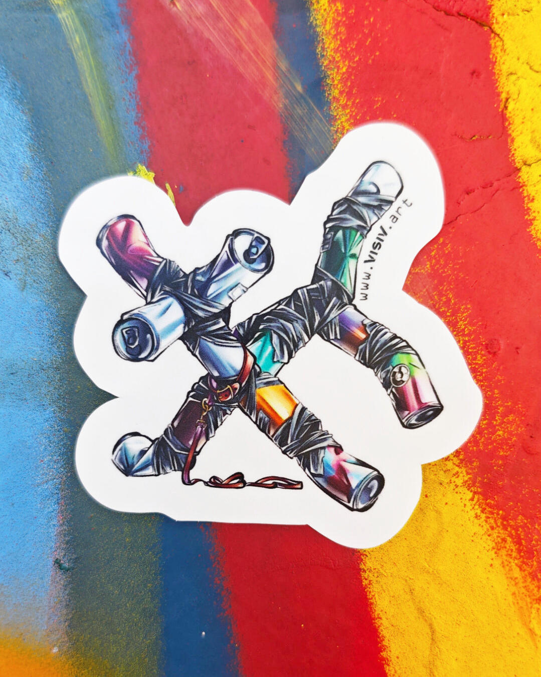 Can Dog sticker photographed on a painted wall with blue, red and yellow brushstroke textures, featuring a white outline and the visiv.art URL.